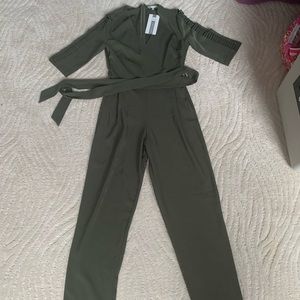 New!! green jumpsuit with slits in arm